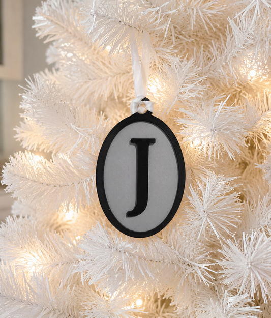 OVAL INITIAL ORNAMENT
